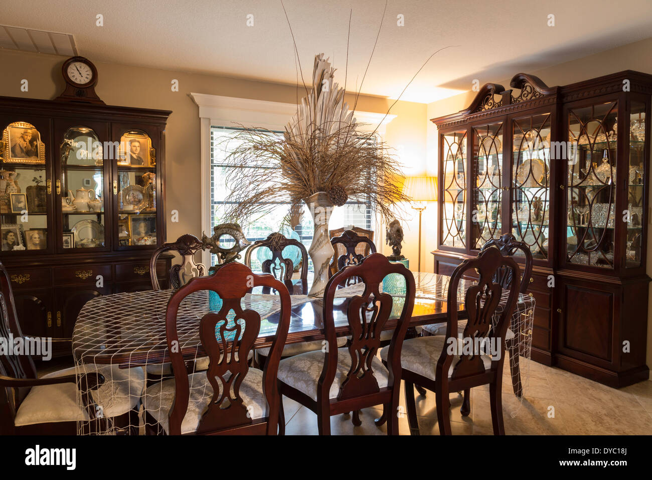 Showcase Dining Room Interior with table, chairs and curio
