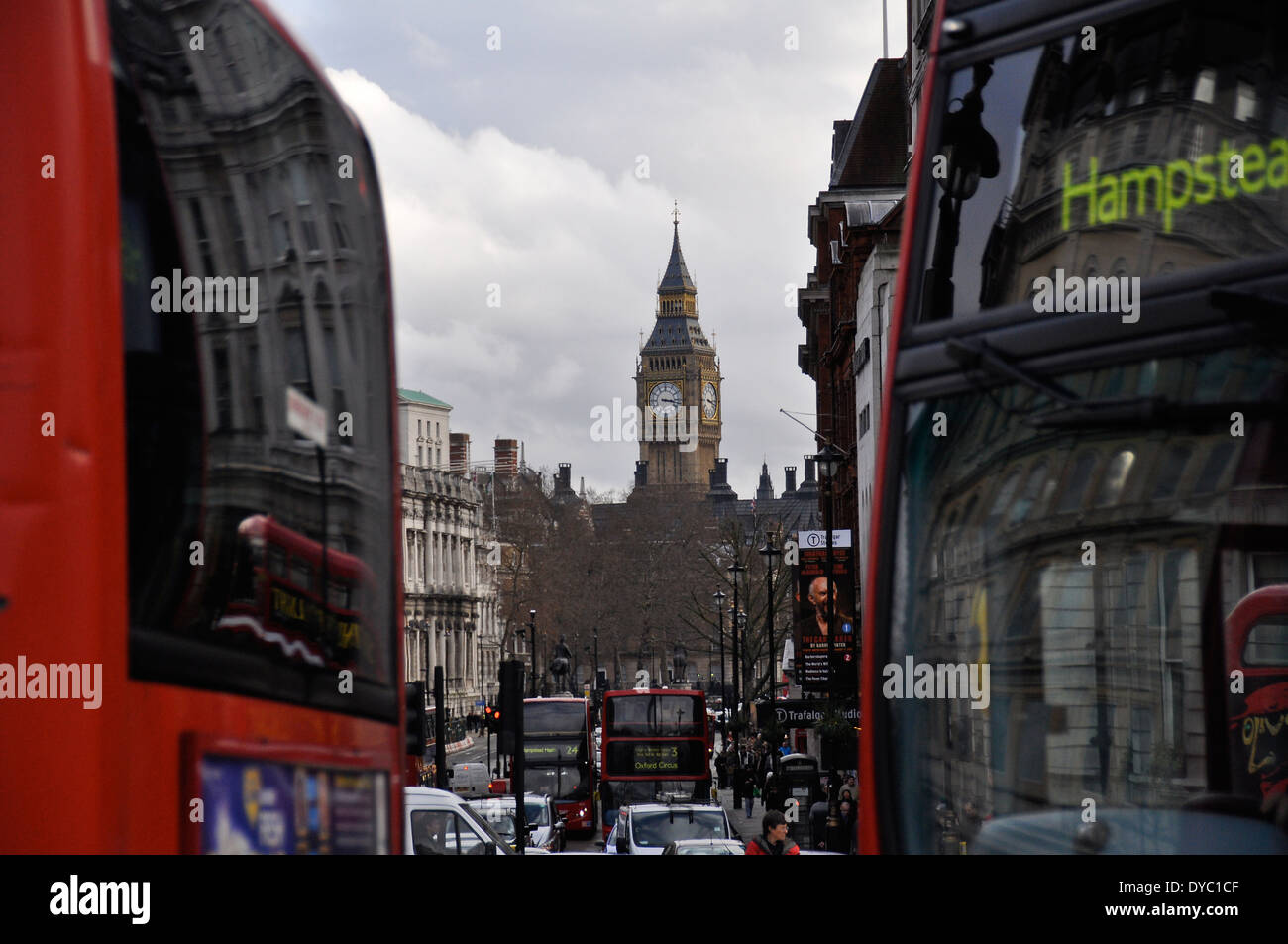 Big Ben between two red buses in London Stock Photo - Alamy