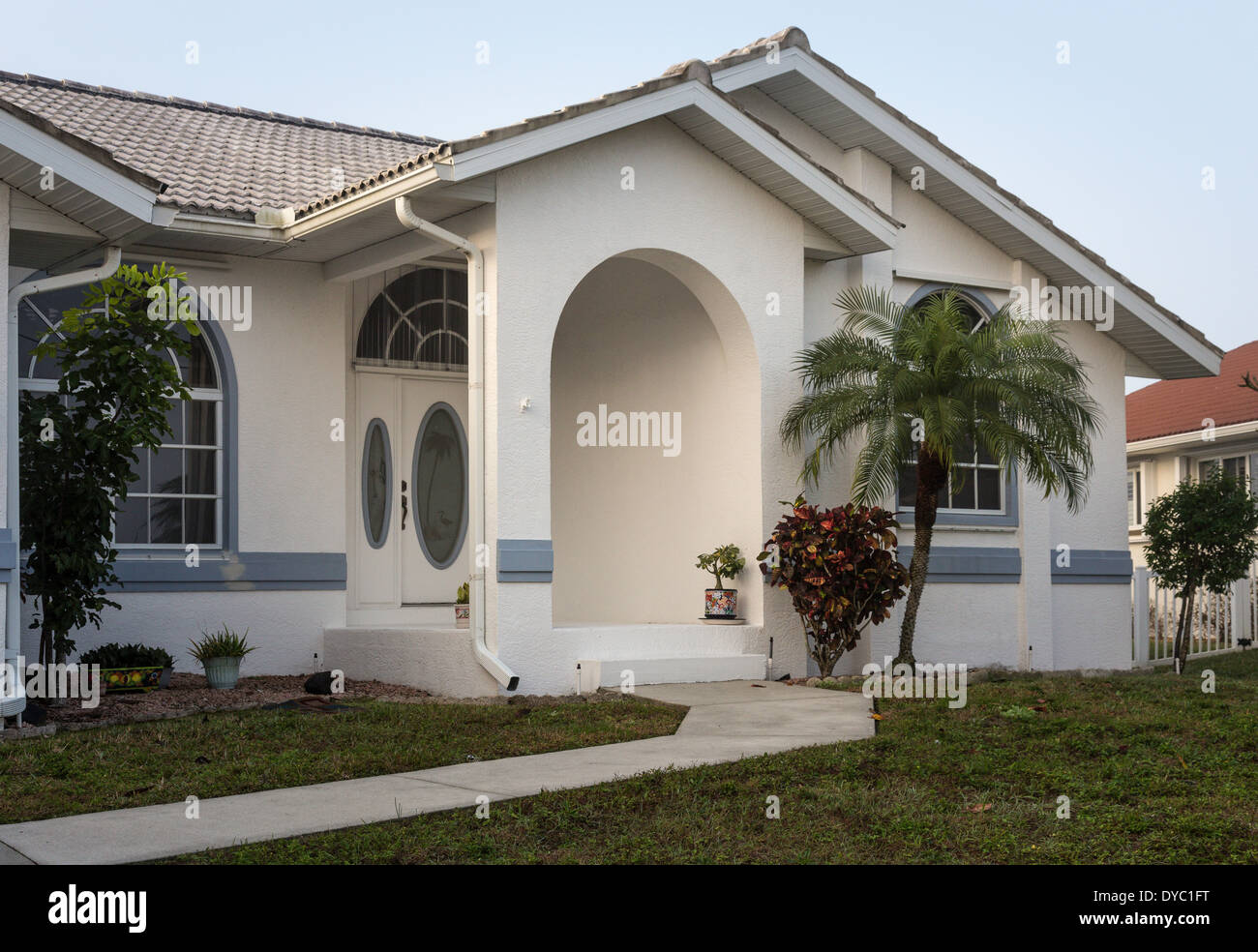 Front of Upscale Florida Suburban Home with Palm Trees, FL, USA Stock Photo