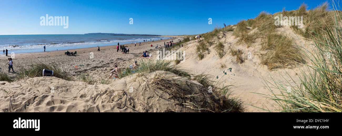 Camber sands, on a sunny warm summers day. A deep blue warm english channel splashing under the warm british sunshine Stock Photo