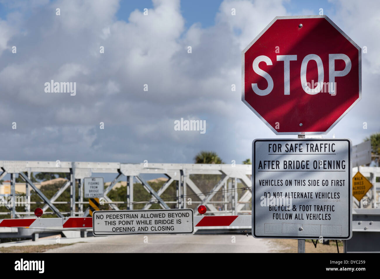 Stop Sign and Instructional Sign, One Lane Bridge, Casey Key, Florida, USA Stock Photo