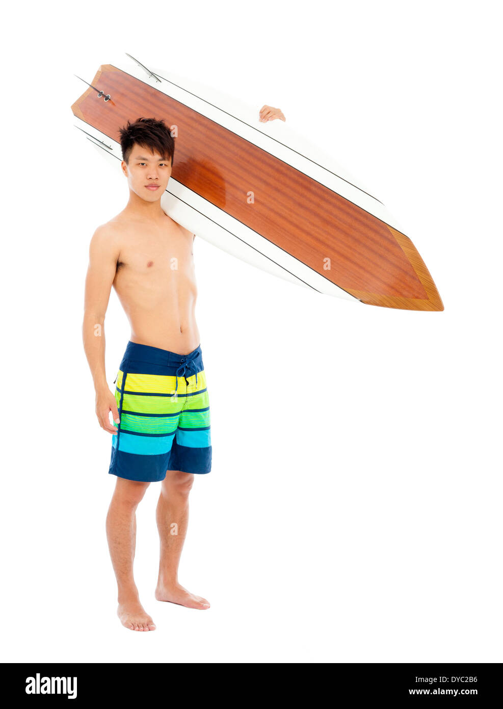 sunny surfer put surfboard on the shoulder in studio Stock Photo