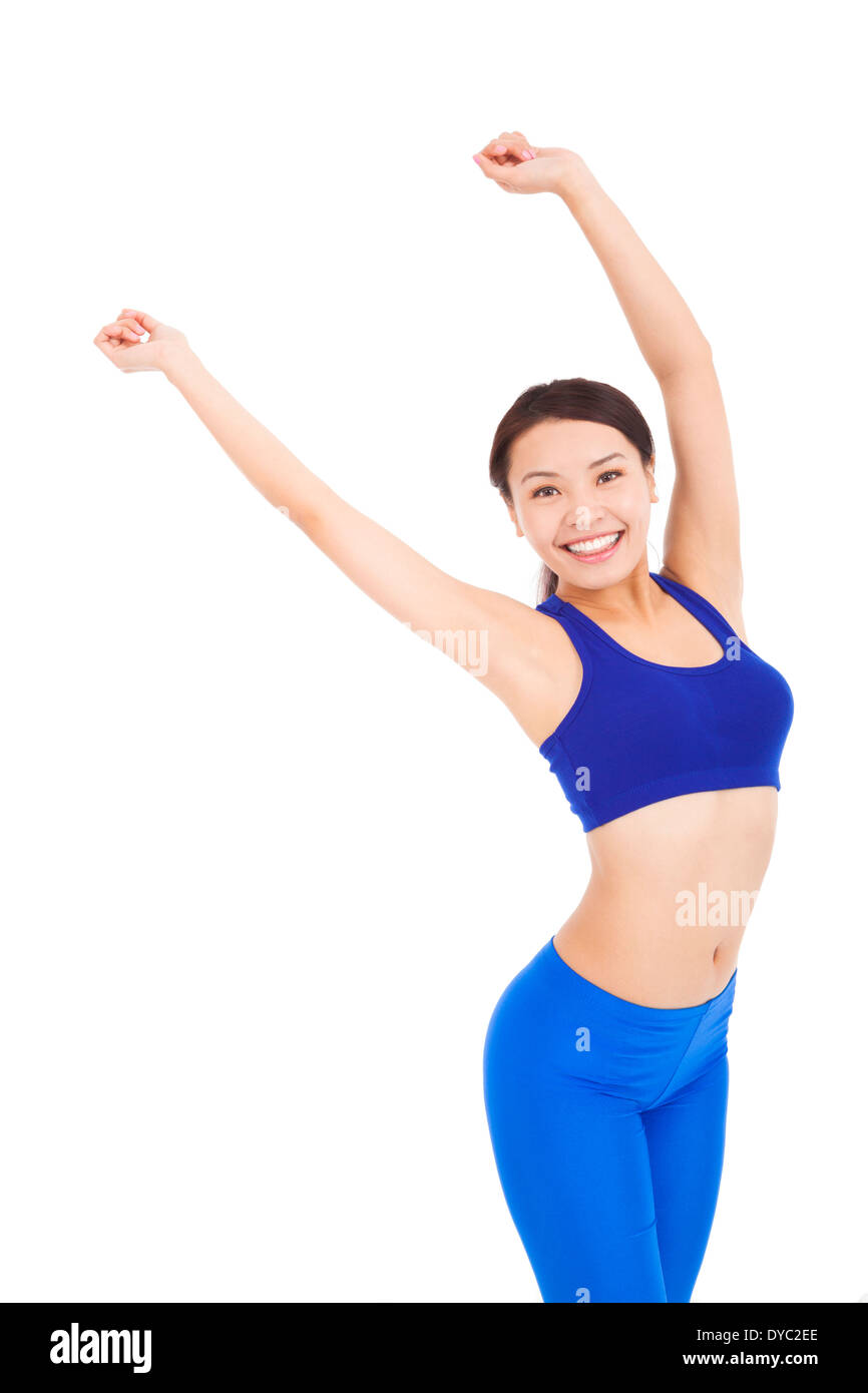 smiling woman make a waving arms pose in studio Stock Photo