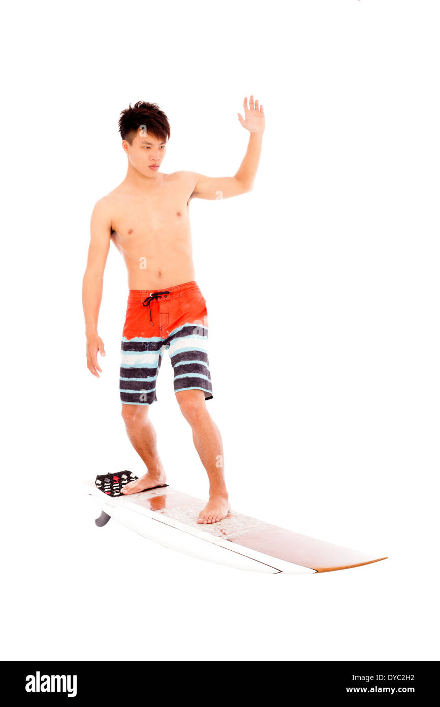 young  surfer practice surfing pose on a white background Stock Photo