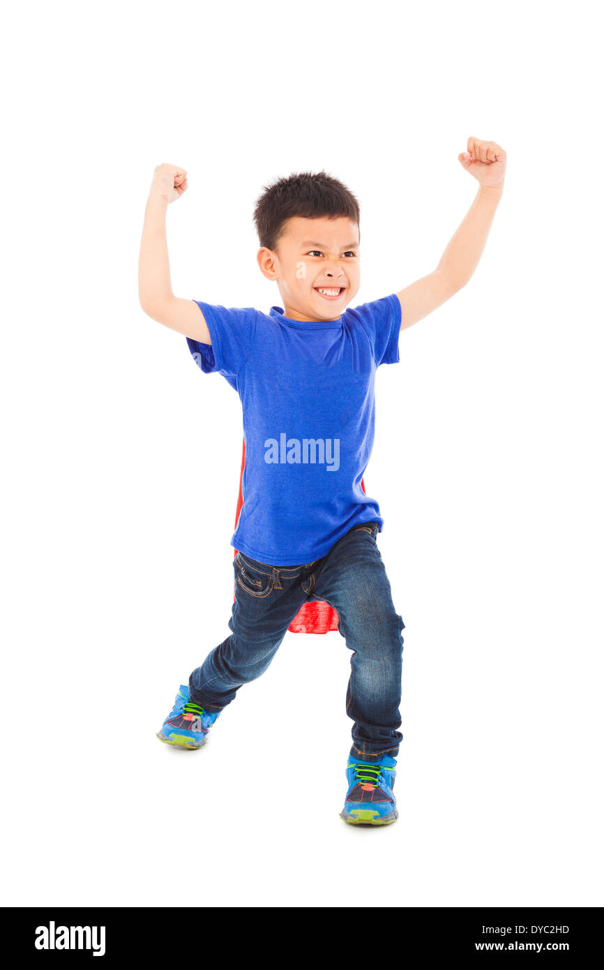 cute kid imitate superman pose and facial expression in studio Stock Photo