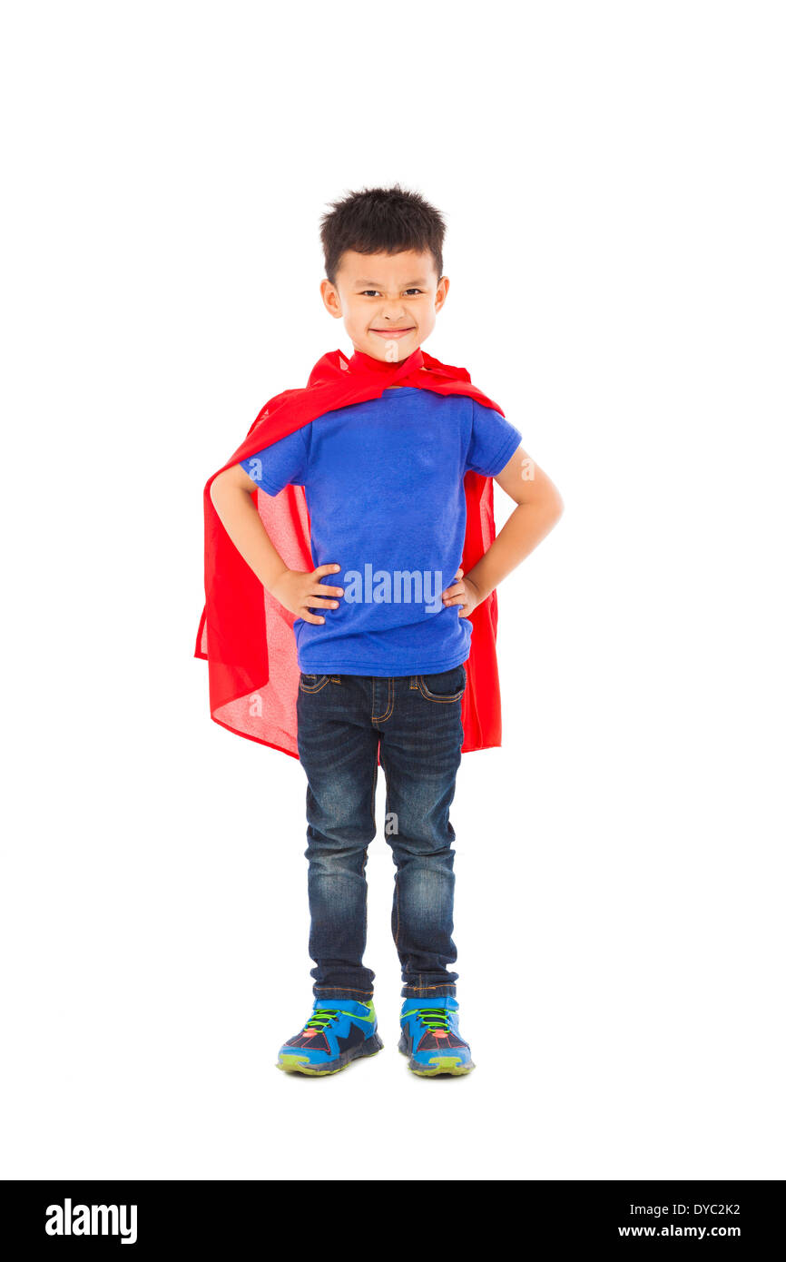 confident Superhero kid standing in studio Stock Photo