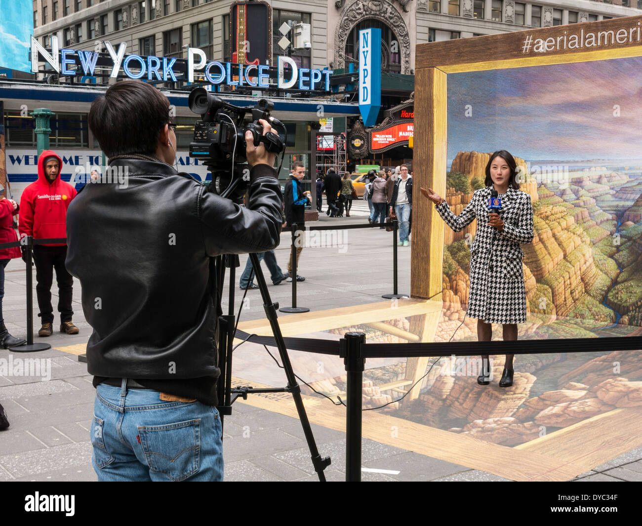 Japanese Female Video Reporter Being Filmed in front of Kurt Wenner's 3D Pavement  Drawing  of The Grand Canyon, NYC, USA Stock Photo