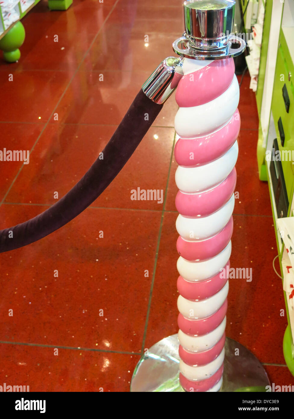 Pink and White Swirl Stanchion and Red Carpet,  FAO Schwarz Flagship Toy Store Interior, NYC Stock Photo