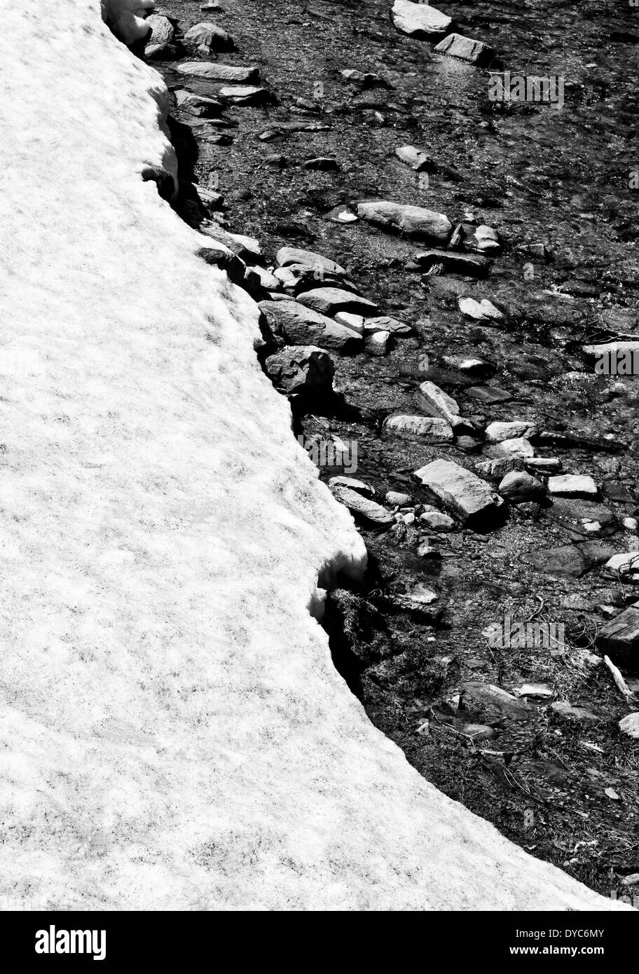 Snow covered river edge, black and white Stock Photo