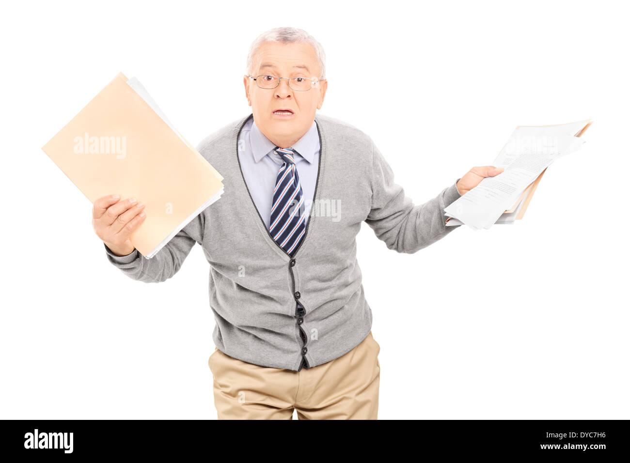 Senior man panicking with papers in his hand Stock Photo