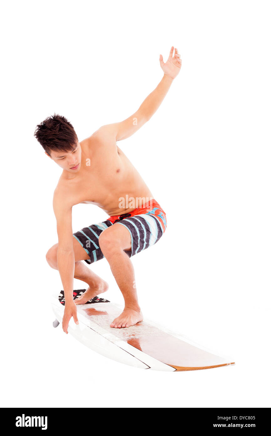 young surfer make a surfing pose Stock Photo