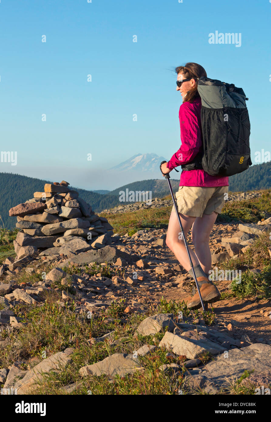 A woman backpacks with a Six Moon Design backpack on the Pacific Crest Trail in Oregon Summer USA Cory Lahr is the model Model Stock Photo
