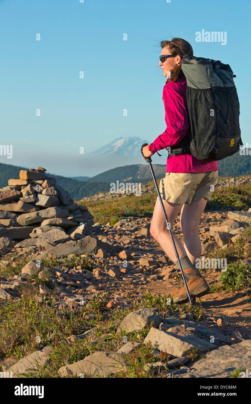 A woman backpacks with a Six Moon Design backpack on the Pacific Crest Trail in Oregon Summer USA Cory Lahr is the model Model Stock Photo