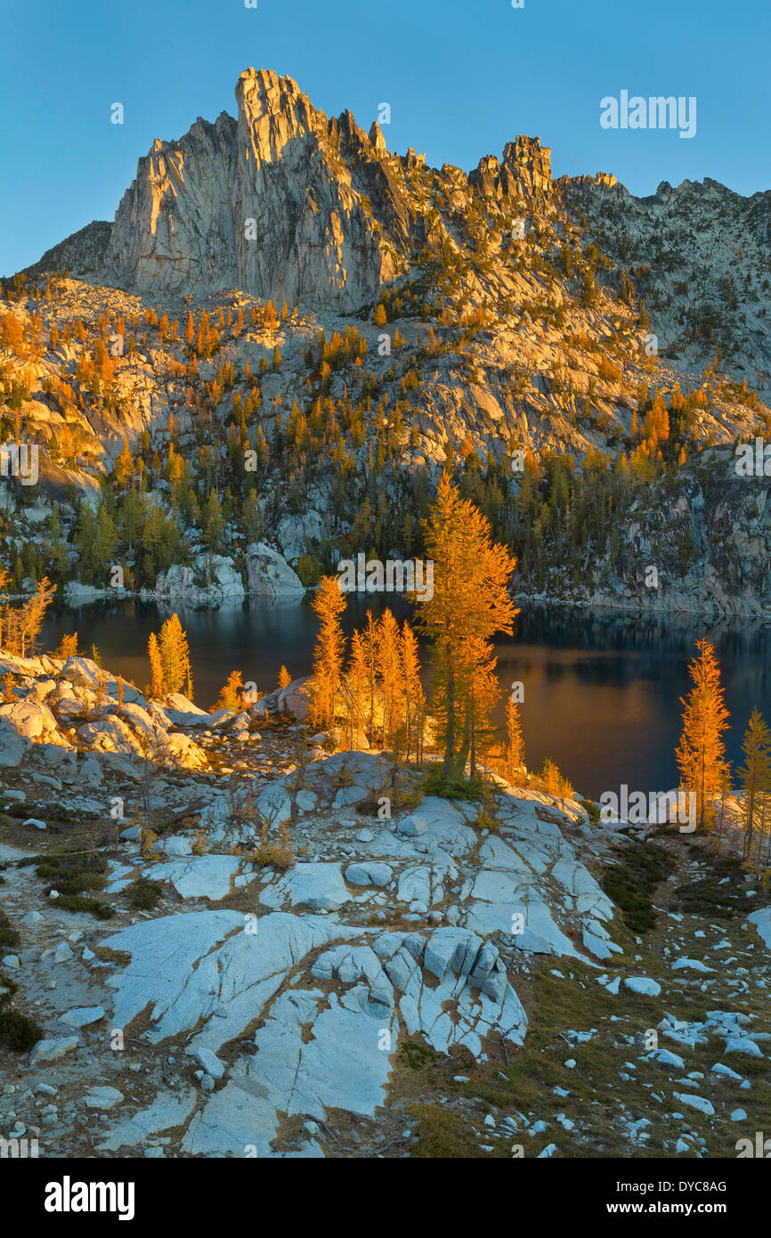 Prusik Peak rises over Lake Viviane at sunrise in the Enchantments section of the Alpine Lakes Wilderness. Stock Photo