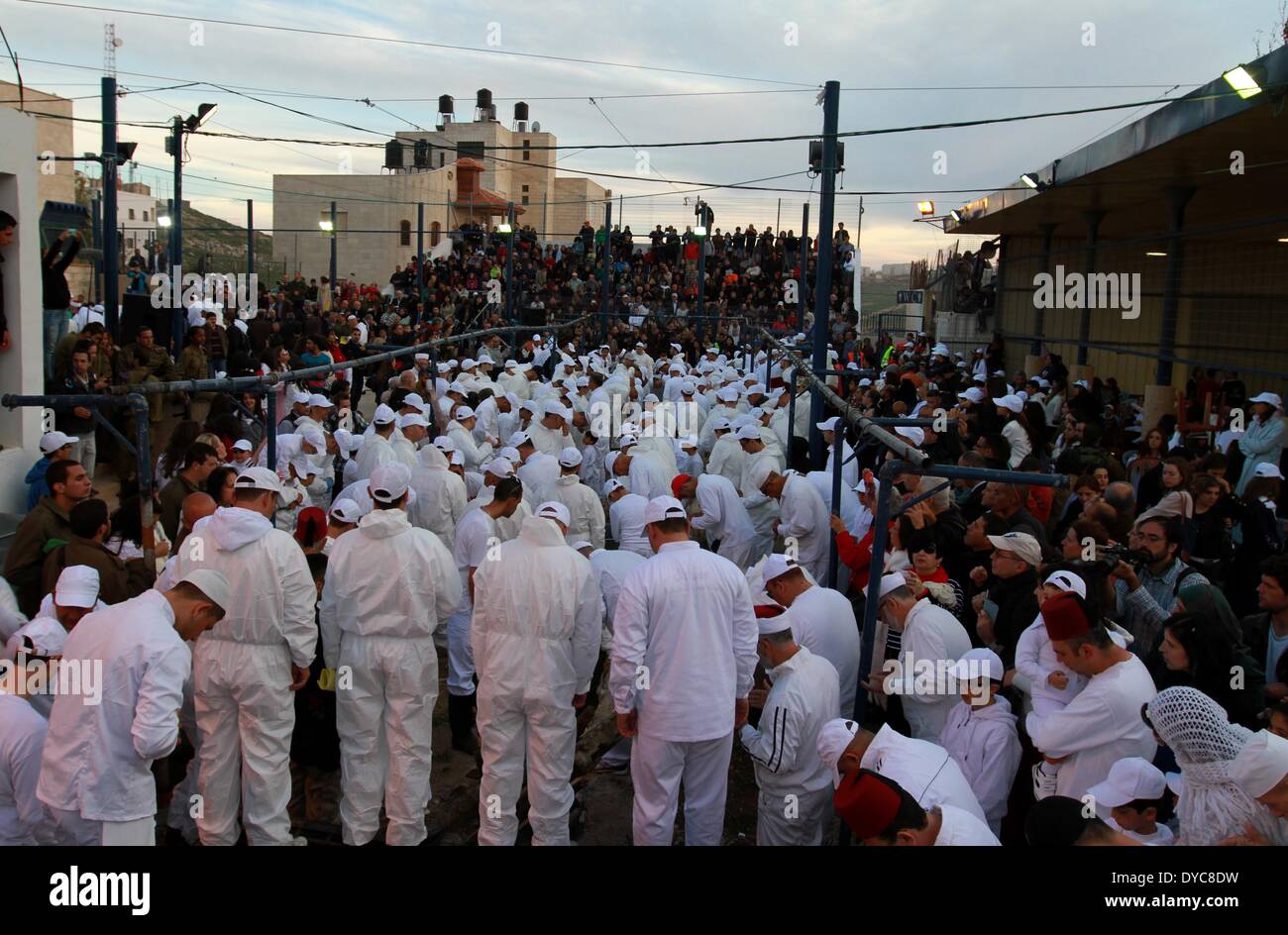(140414)-- NABLUS, April 14, 2014 (Xinhua) -- Members of the Samaritan sect participate in the traditional Passover sacrifice on Mount Gerizim, near the West Bank city of Nablus, on April 13, 2014. Samaritans have been present on the Land of Israel for over 2,500 years. Their religion is considered Abrahamic, a very close relative of Judaism in ritual observance. (Xinhua/Ayman Nobani) Stock Photo