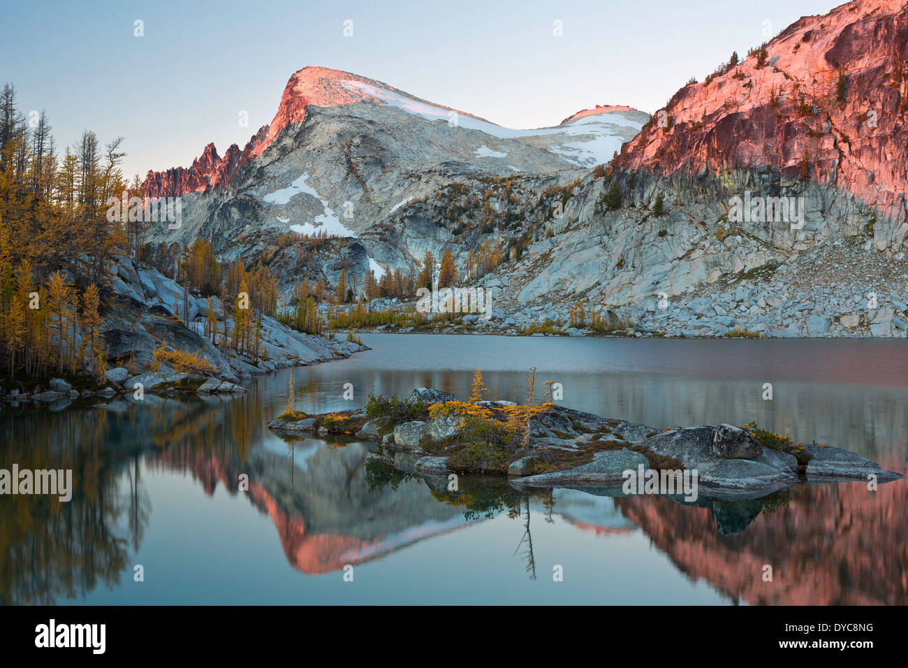 Little Annapurna mountain reflects in Perfection Lake in the Alpine Lakes Wilderness Enchantments section at sunrise Washington Stock Photo