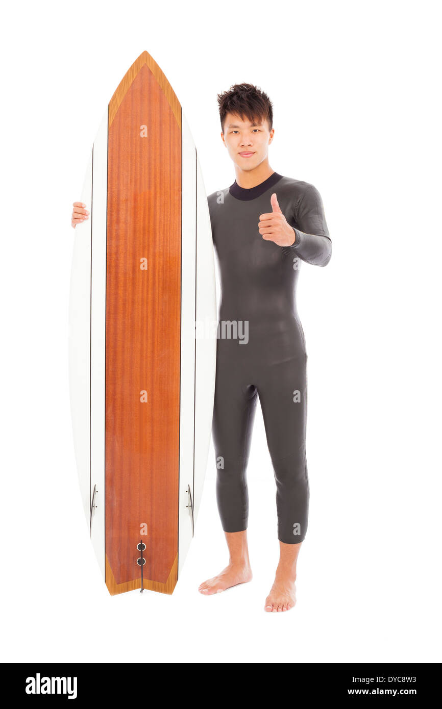 surfer man holding a surfboard and thumb up Stock Photo