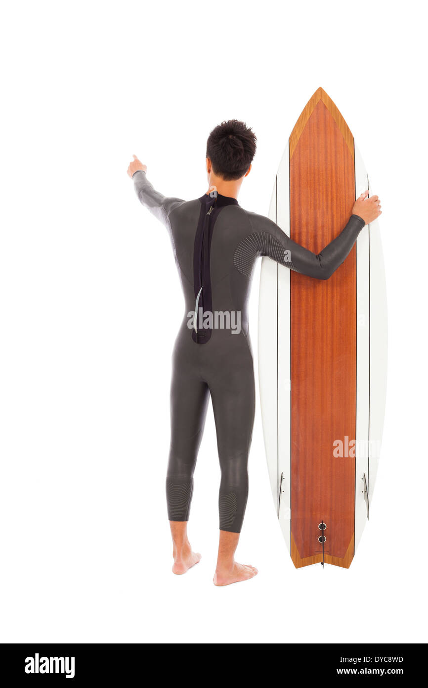 surfer man holding a surfboard and point somewhere Stock Photo