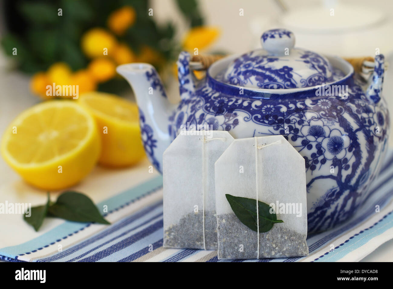 Tea bags, vintage teapot and fresh lemon Stock Photo Alamy