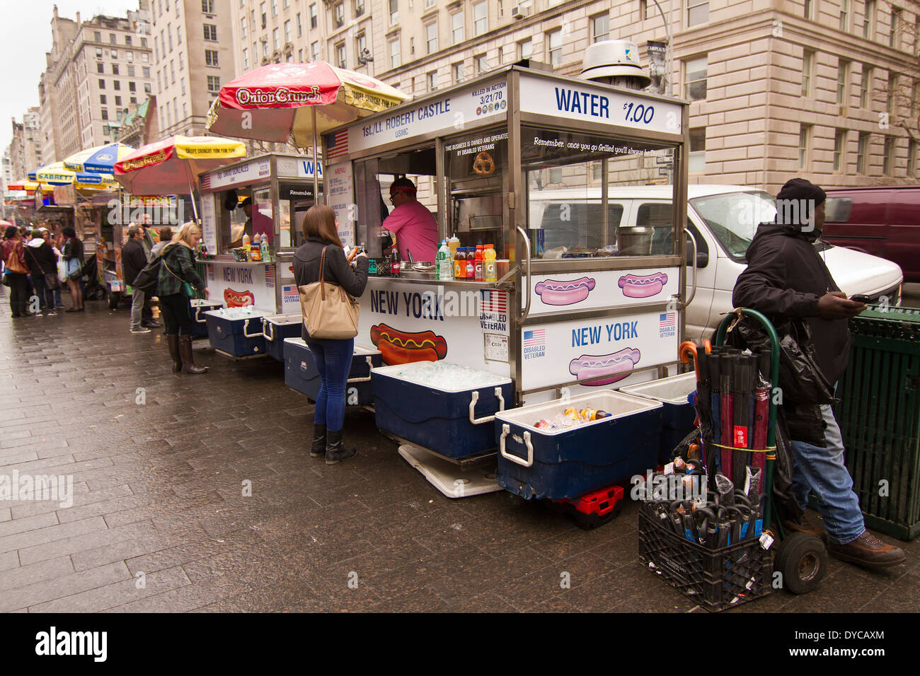 Row of Mobile Fast Food vendors outside the Metropolitan Museum in New York on a rainy day Stock Photo