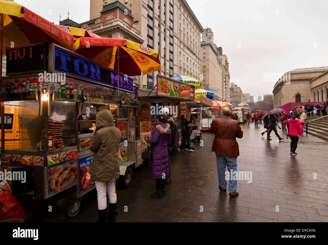 Row of Mobile Fast Food vendors outside the Metropolitan Museum in New York on a rainy day Stock Photo