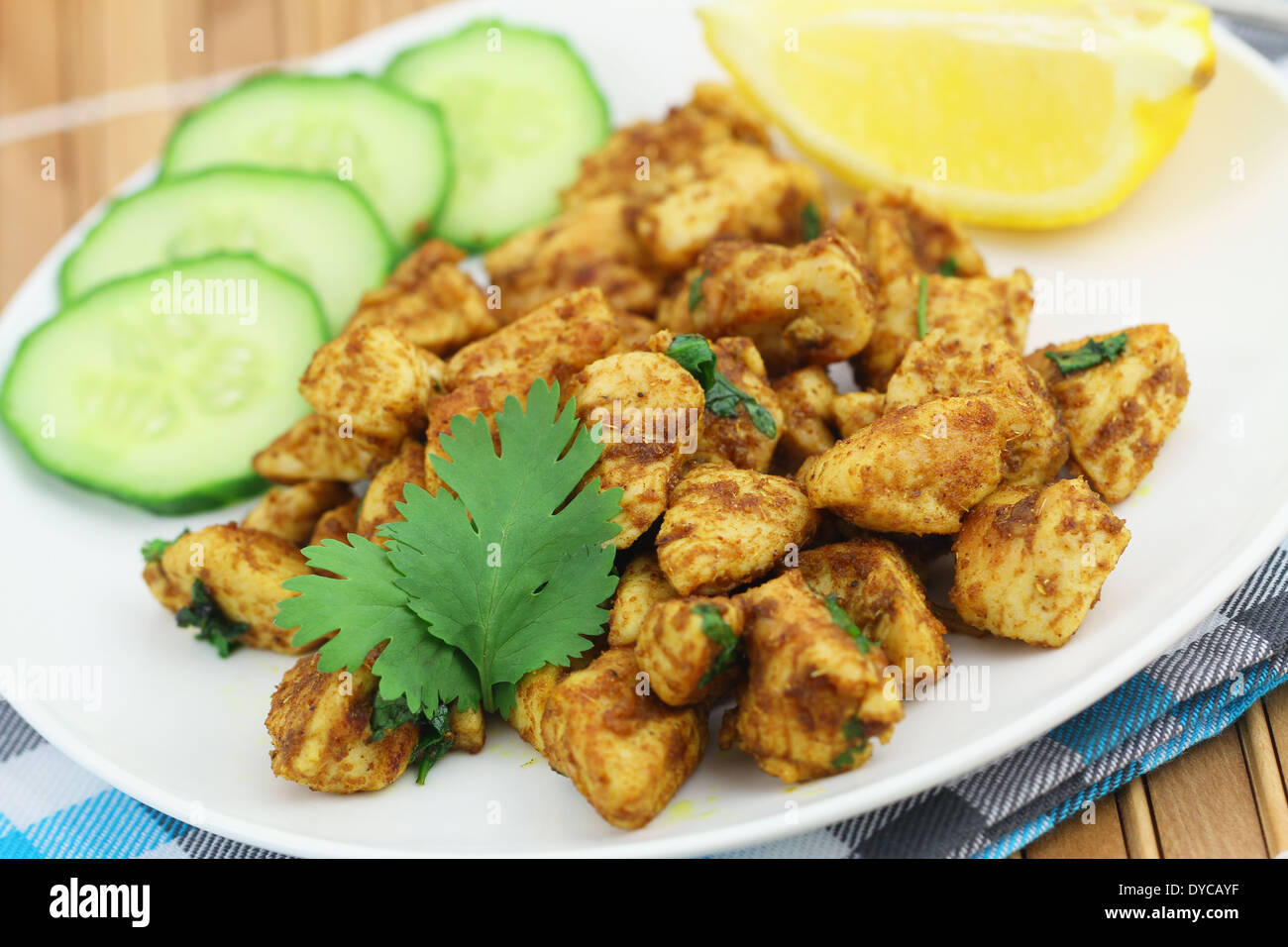 Spicy chicken with fresh coriander Stock Photo Alamy