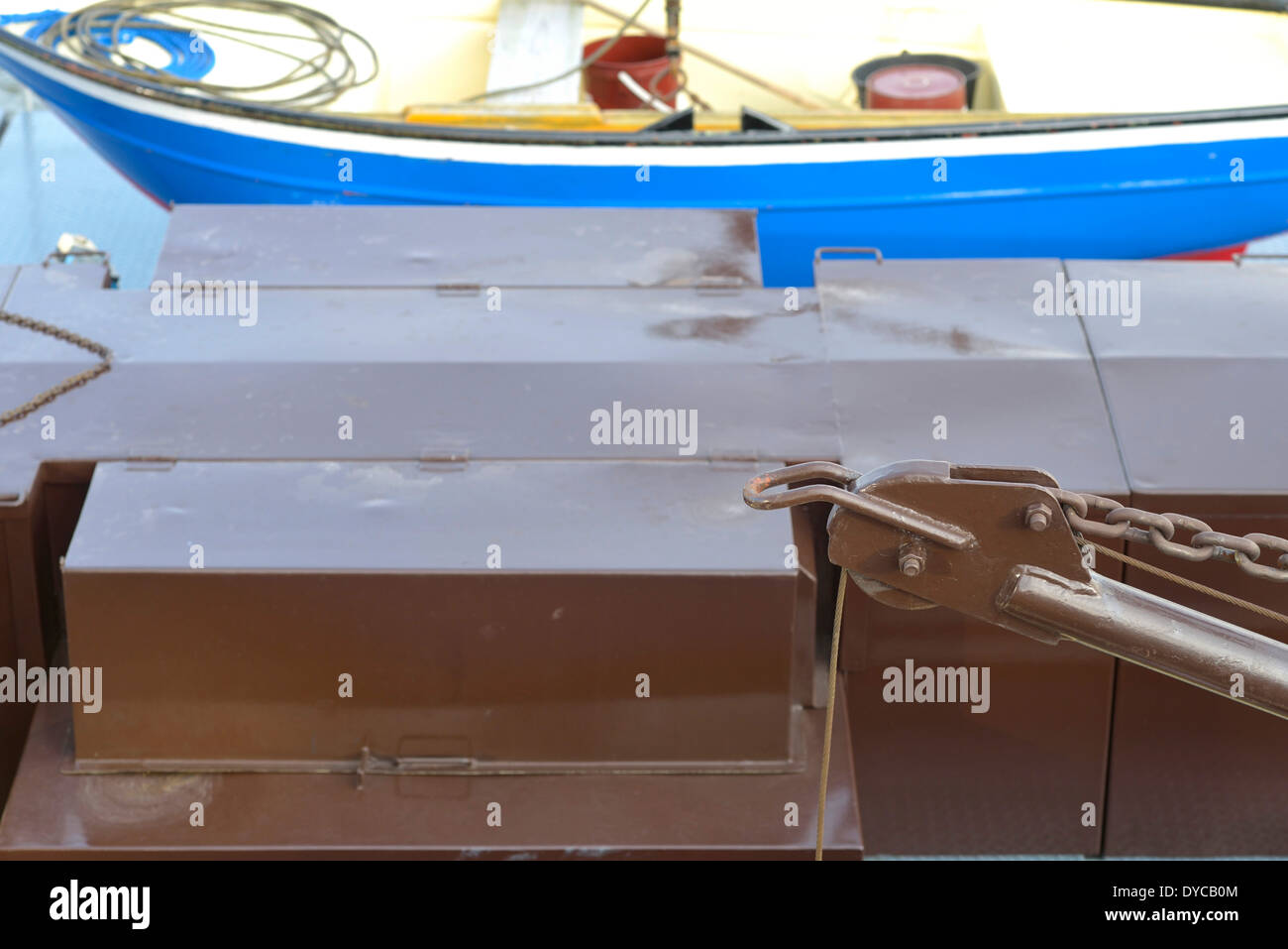 Detail of a lifeboat on the deck of an oil tanker with a neatly coiled
