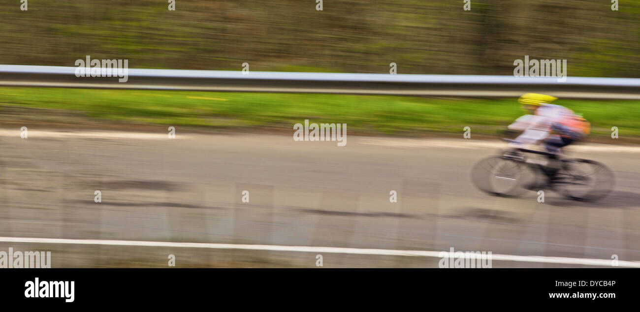 Cyclist in motion downing a hill Stock Photo