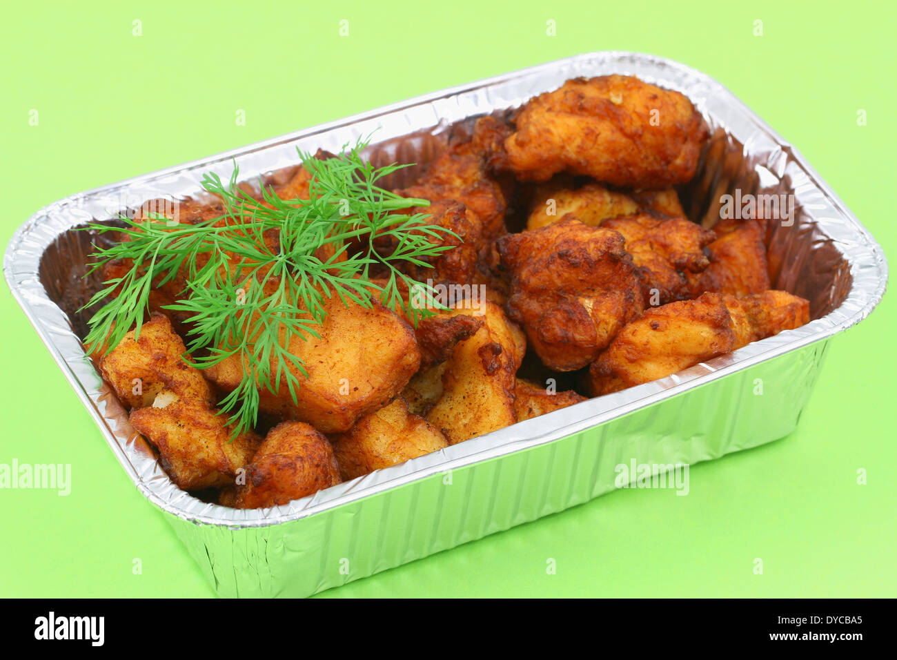 Fried cod pieces in take away tray Stock Photo