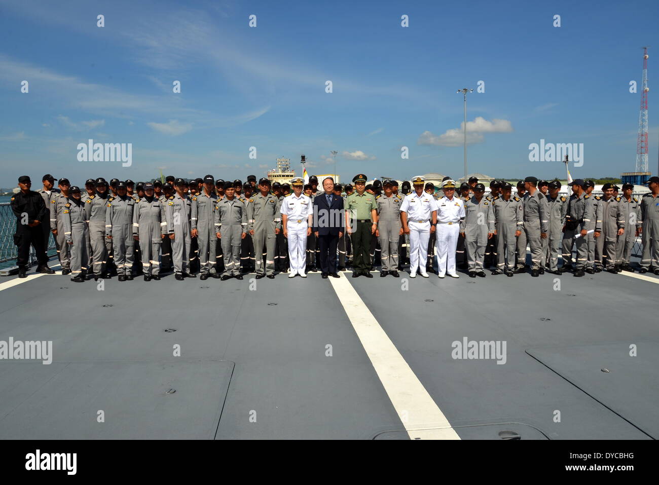 Muara Port, Brunei. 14th Apr, 2014. Officers pose for photos on a Royal Brunei Navy vessel in Muara Port, Brunei, April 14, 2014. A total crew of 69 Royal Brunei Navy (RBN) personnel including attachments set sail on their vessel KDB DARULEHSAN on Monday to attend the Western Pacific Naval Symposium and join the Multilateral Maritime Exercise (MMEx) to be held in Qingdao, a port city in China's Shandong province. © Zheng Jie/Xinhua/Alamy Live News Stock Photo