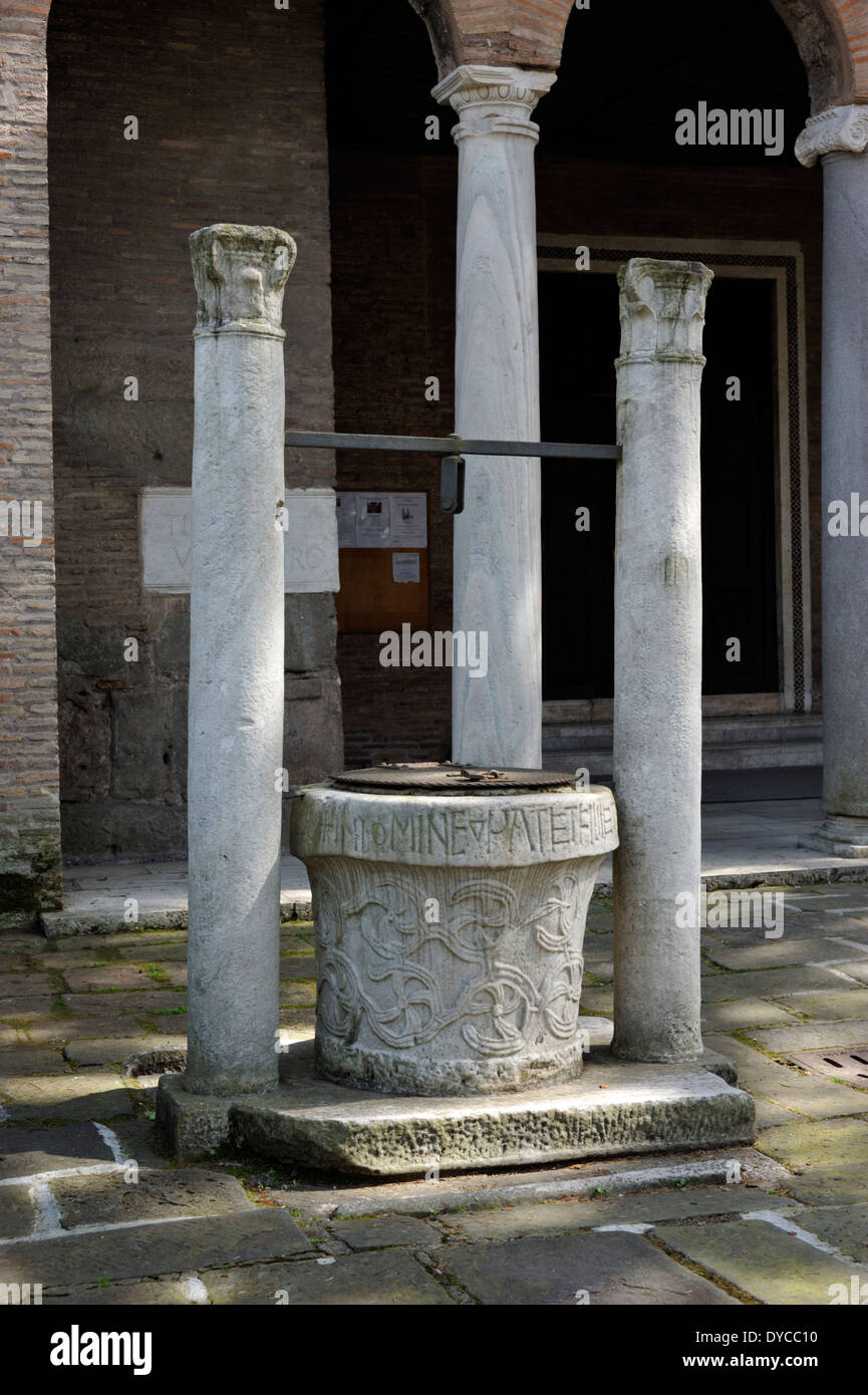 Italy, Rome, church of San Giovanni a Porta Latina, medieval well (10th century) and columns (4th century) Stock Photo