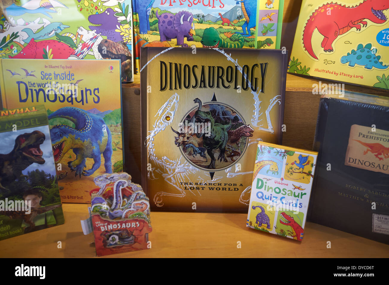 Childrens dinosaur books in shop window Stock Photo
