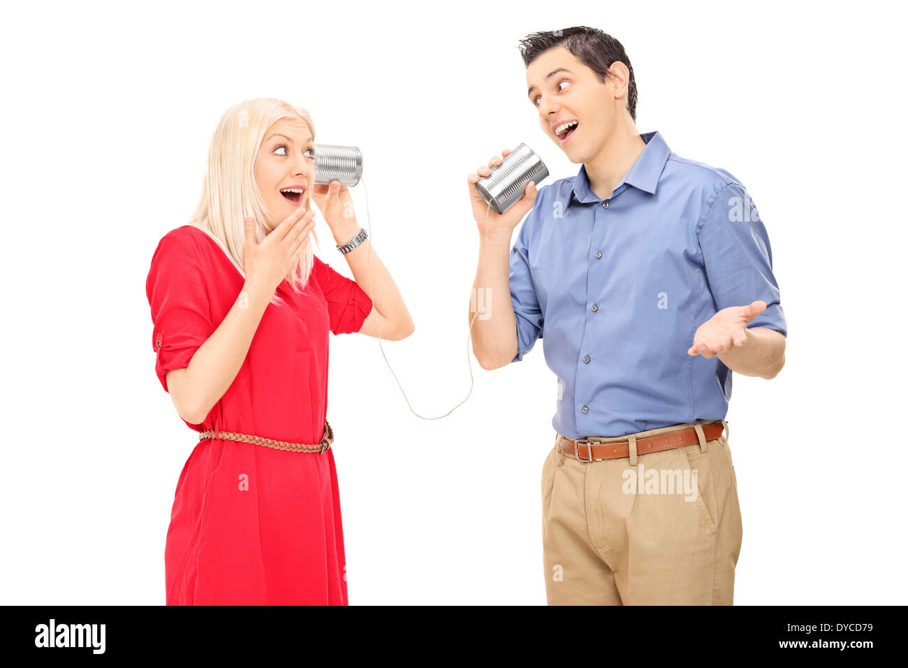 Man and woman talking through a tin can phone Stock Photo