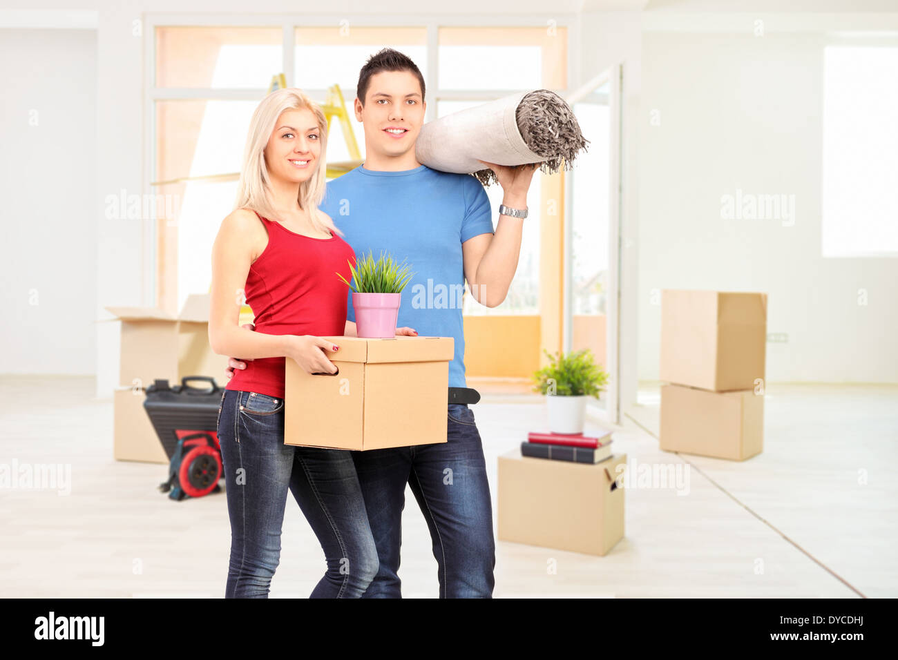 Young couple moving into a new apartment Stock Photo - Alamy