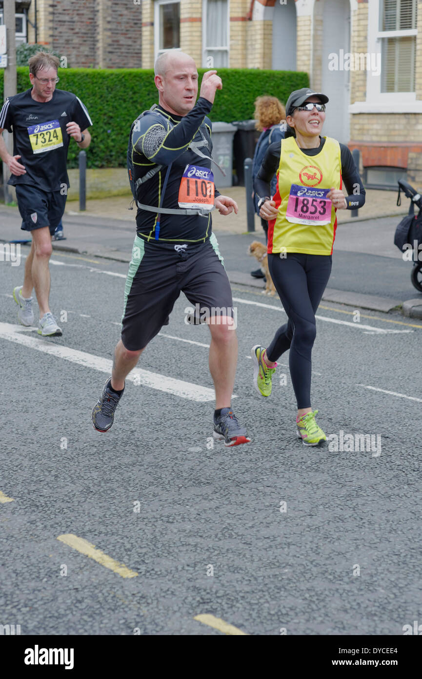 The 2014 Manchester Marathon Runners reach Market Street, Altrincham in Cheshire Stock Photo