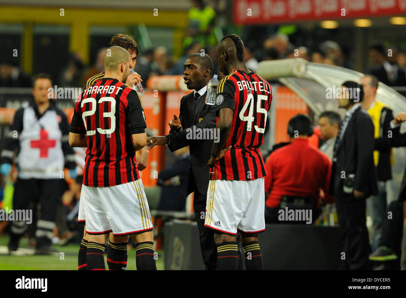 Milan, Italy.  14th April, 2014. Head coach AC Milan Clarence Seedorf speaks with Adel Taraabt (L) and Mario Balotelli (R) during the Italian Serie A league match between AC Milan and Calcio Catania at San Siro Stadium in Milan, Italy. Credit:  Action Plus Sports Images/Alamy Live News Stock Photo