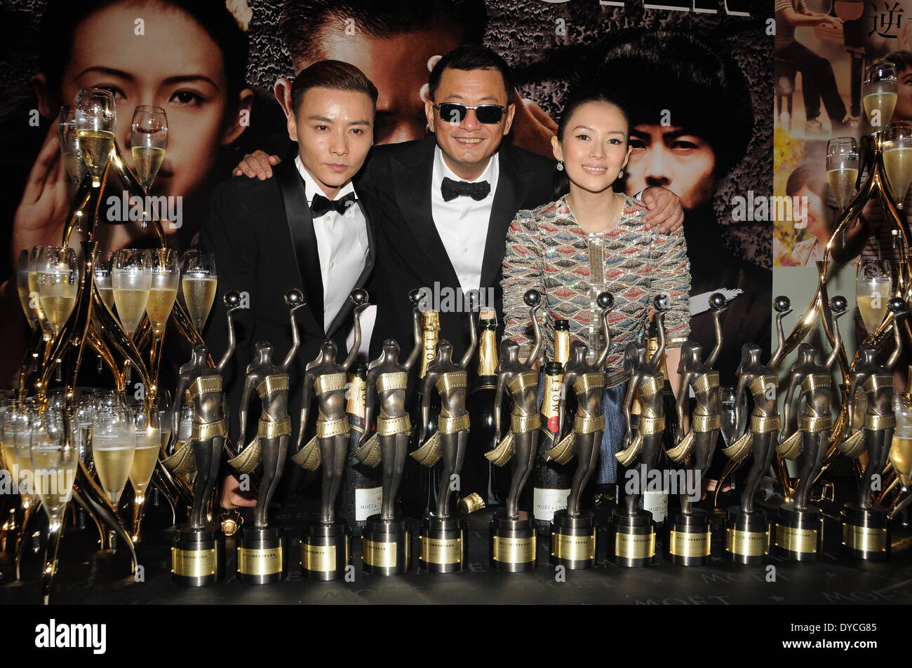 Hong Kong. 13th Apr, 2014. Zhang Jin(L), Wong Karwai and Zhang Ziyi at celebration party after The 33rd Hong Kong Film Awards in Hong Kong, China on Sunday April 13, 2014.Wong Karwai's kungfu epic 'The Grandmaster' was the biggest winner at the 33rd Hong Kong Film Awards, held on the night of April 13, as the film took home 12 awards, including Best Film, Best Director, Best Screenplay and Best Actress. Credit:  Top Photo Corporation/Alamy Live News Stock Photo