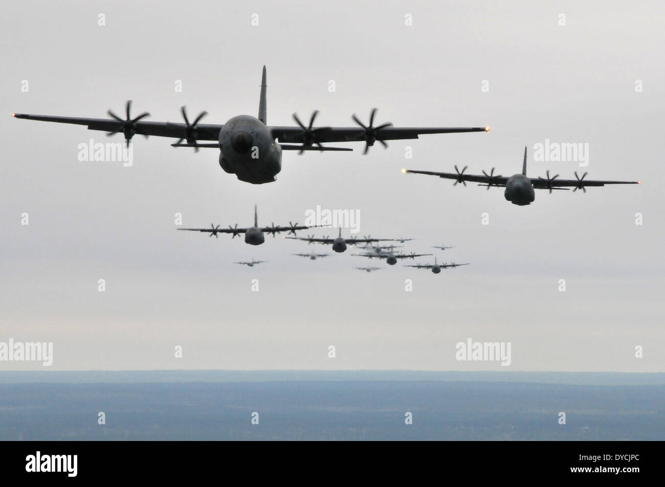 US Air Force C-130J and WC-130J transportation aircraft fly in formation during a large scale training exercise April, 5, 2014 in Biloxi, Mississippi. Stock Photo