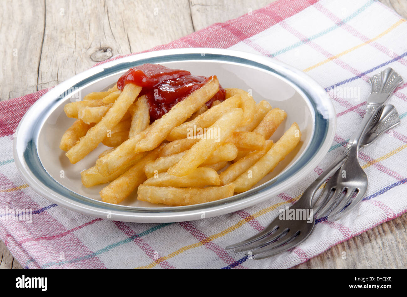 warm french fries with ketchup and fork Stock Photo Alamy