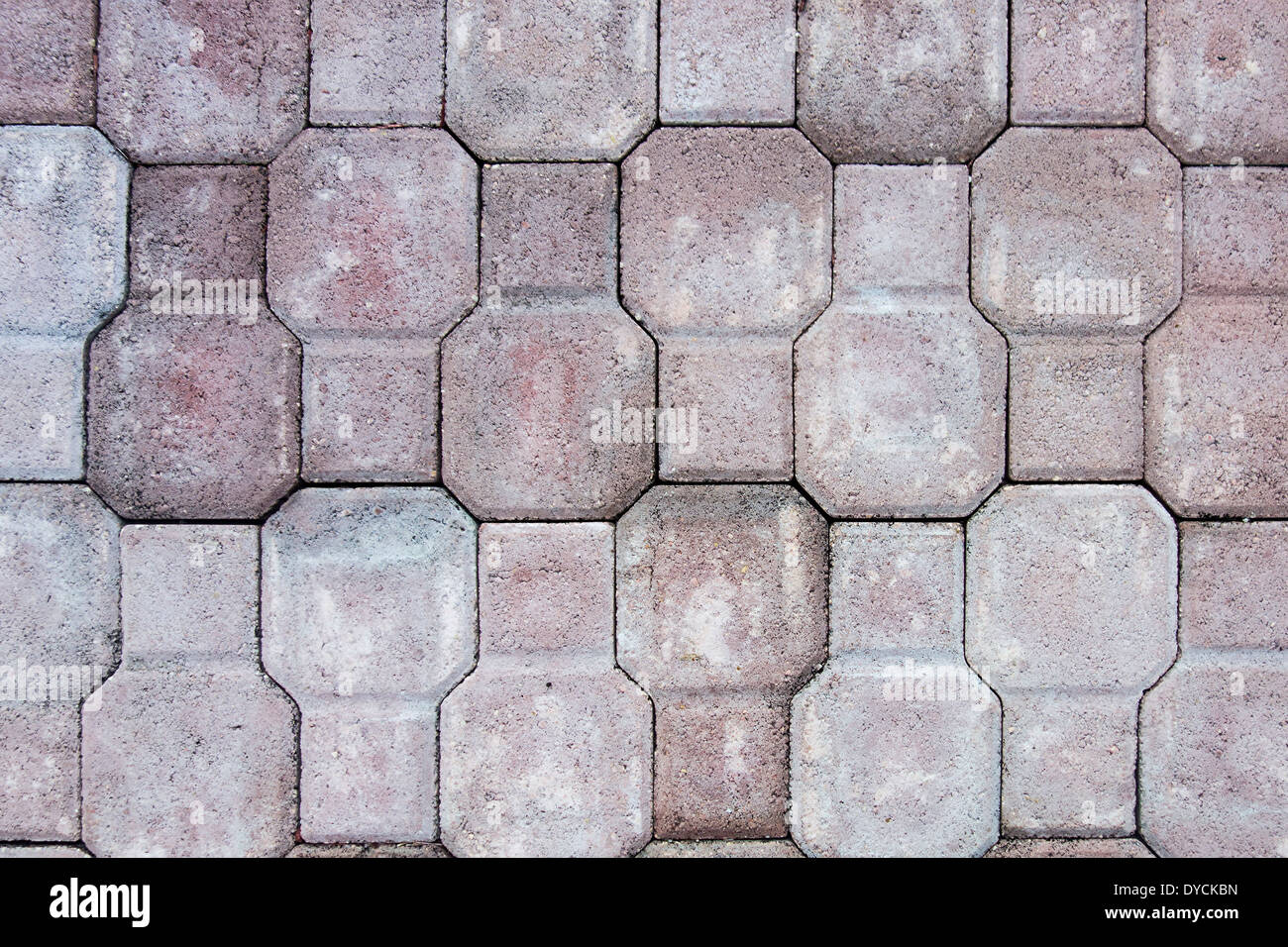 Manufactured paving stones on a walkway in a soft rose color. Background, backgrounds. Stock Photo