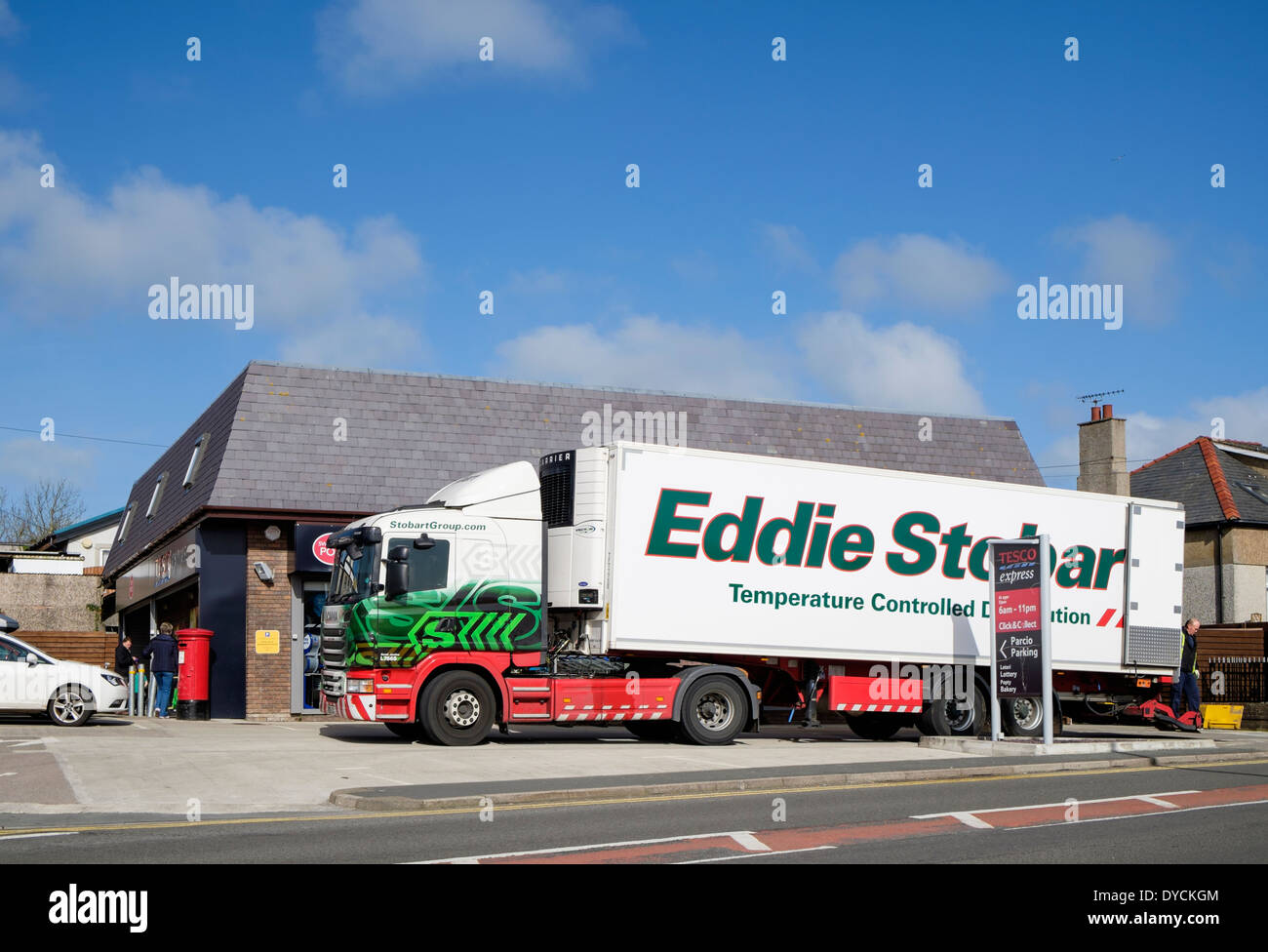 Eddie Stobart temperature controlled distribution delivery lorry delivering to a Tesco Express store. Wales UK Britain Stock Photo