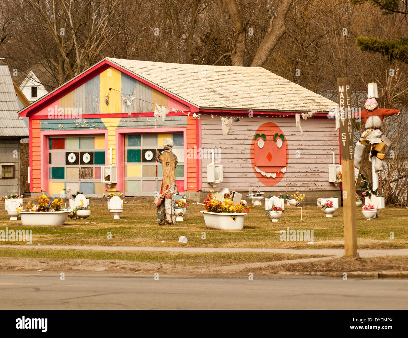 residential lawn with decorated toilets and bathtubs Stock Photo Alamy
