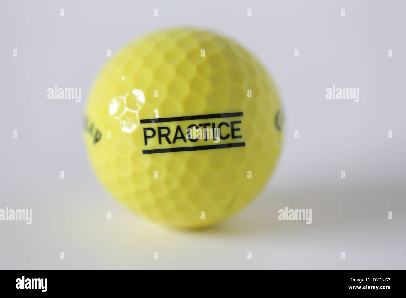 yellow practice golf ball Stock Photo
