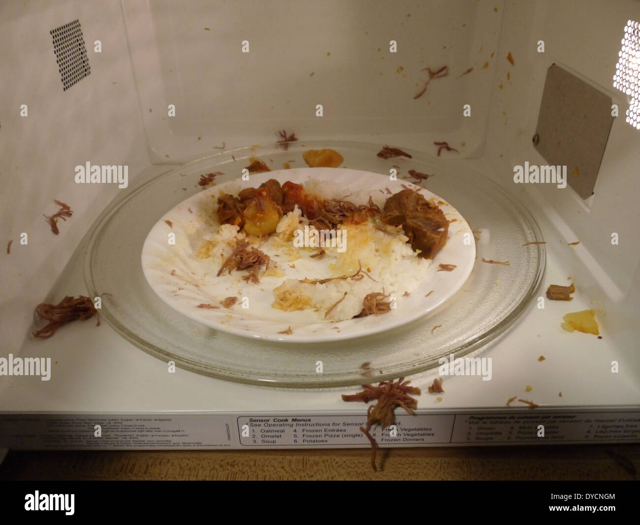 messy microwave food everywhere Stock Photo