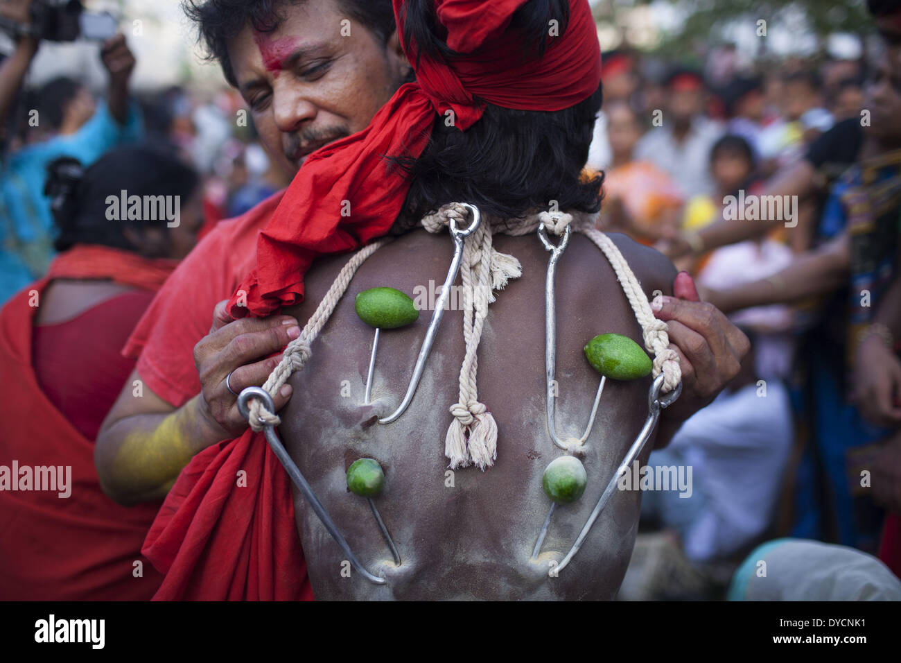 Bangladesh. 14th Apr, 2014. A group of Hindu devotees perform the rituals of Charak Puja. It is a very enchanting folk festival of Southern Belt of Bangladesh and West Bengal. It is also known as ''Nil Puja''. The believers of Hindu religion celebrate this on the last day of the Bengali month of the year (Chaitra Songkranti). People believe that the festival will carry prosperity by eliminating the sorrow and sufferings of the previous year. The festival is actually a festival to satisfy ''Lord Shiva'', the great ''Debadideb'' of Hindu Religion. (Credit Image: © Probal Rashid/NurPhoto/ZUMAPR Stock Photo