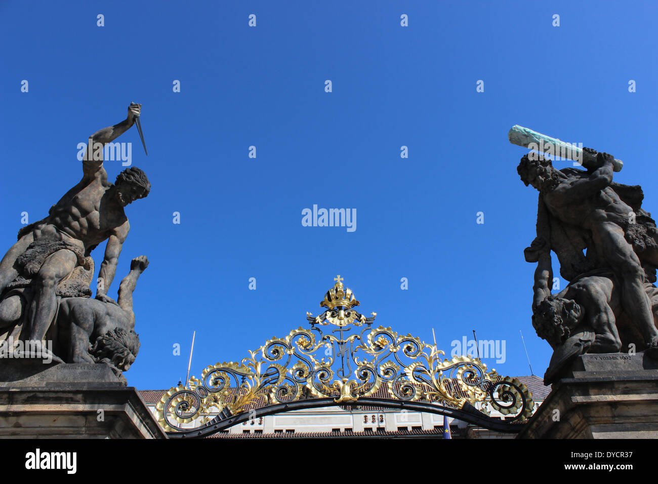 Sculpture above columns flanking the main gates to Prague castle (Hrad) Stock Photo