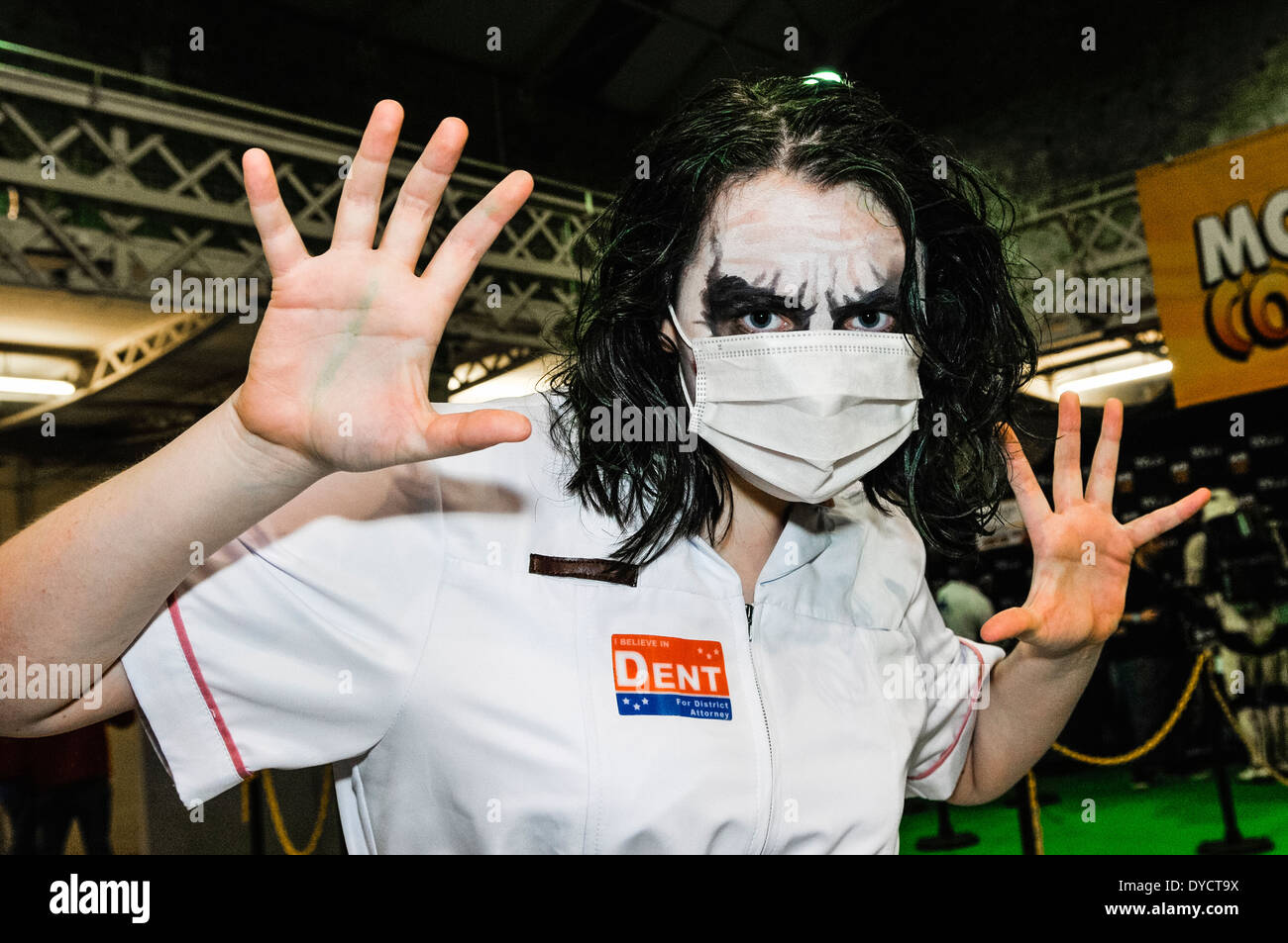 A teenage boy dressed as the Joker dressed as a nurse from the film Batman: The Dark Knight, at a sci-fi convention Stock Photo