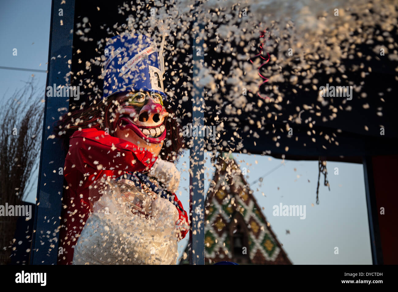 So called Waggis throwing confetti at the Basel carnival in Switzerland. Stock Photo