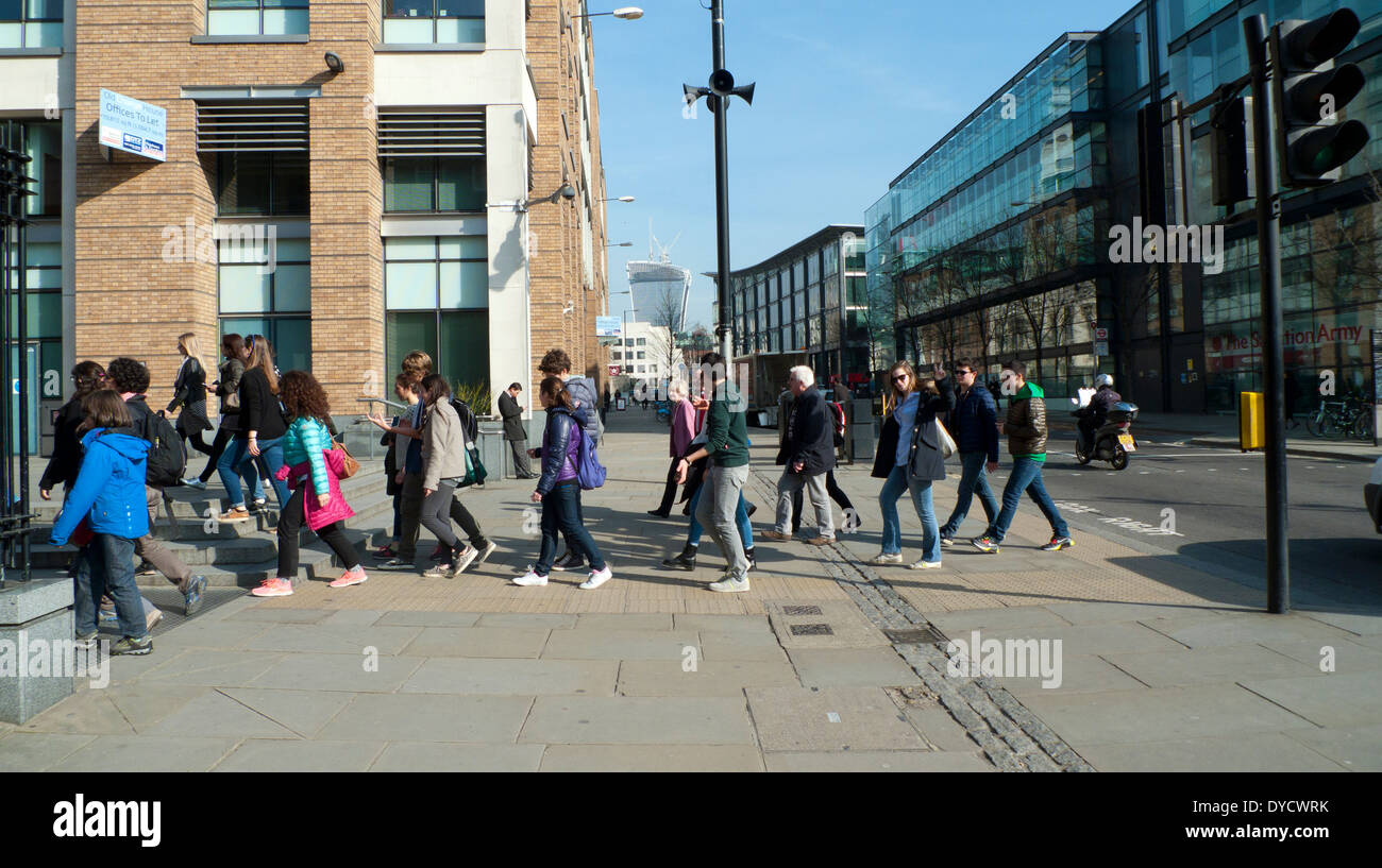 A group of young people walking near St. Paul's Cathedral, Central London England UK  KATHY DEWITT Stock Photo