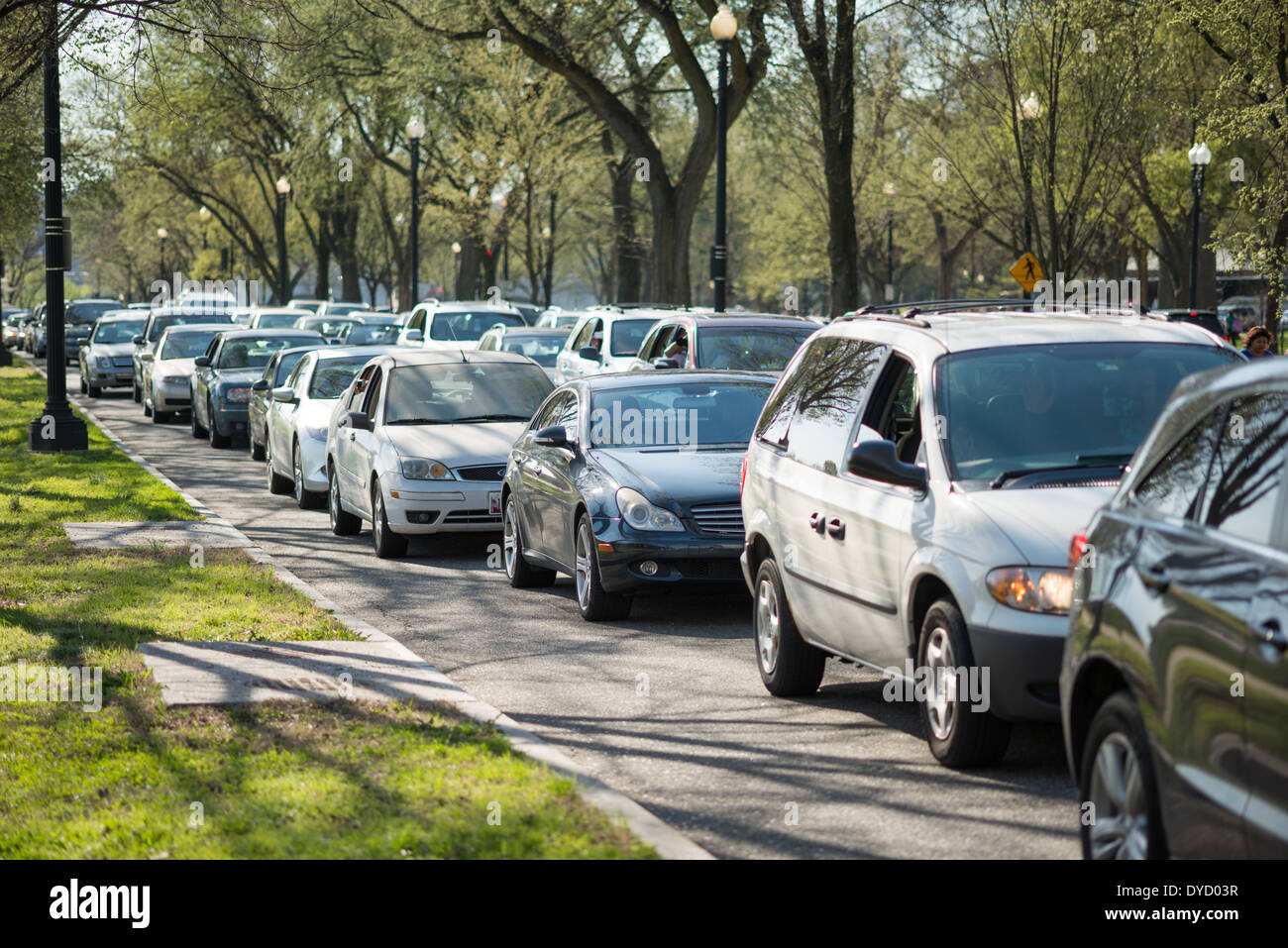 Two lanes of cars are stuck in heavy traffic in Washington DC. Stock Photo